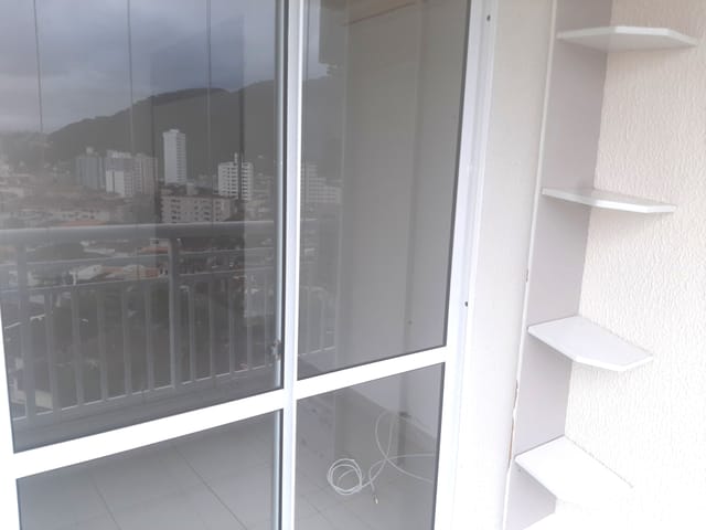 Foto do Apartamento - Apartamento para locação de 2 quartos frente pra rua, andar alto, com suíte e vaga suficiente no Acquaplay Santos no Marapé. | eHG Imóveis