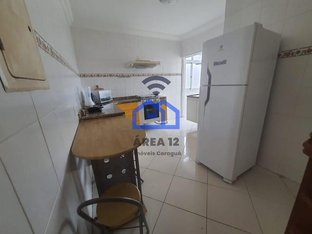 Foto do Apartamento - Apartamento para locação com uma suíte master e varanda com churrasqueira no bairro Martim de Sá em Caraguatatuba, SP | Área 12 imóveis