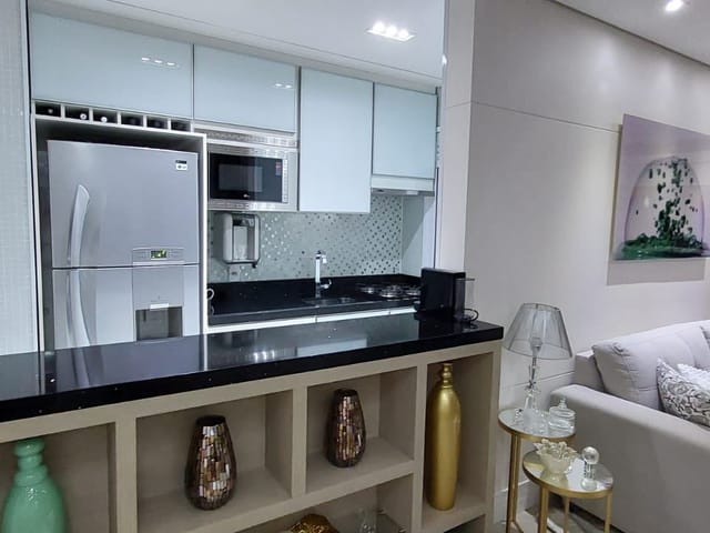 Foto do Apartamento - Apartamento à venda 2 dormitórios e 2 vagas de garagem na Chácara Inglesa, Cozinha americana planejada, Terraço gourmet envidraçado. Andar Alto | Paulista Imóveis.