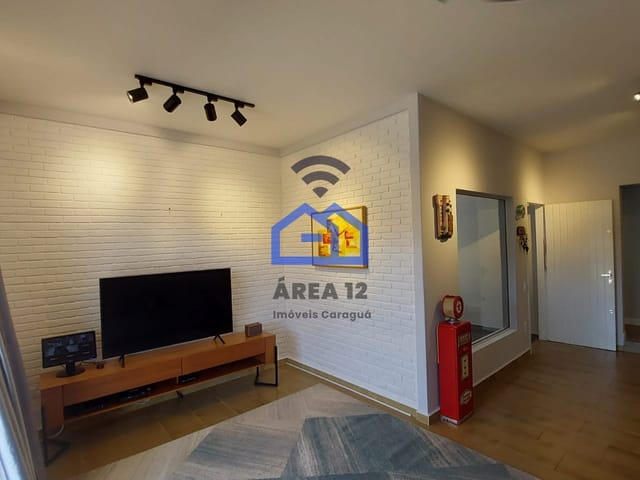 Foto do Casa - Casa à venda no bairro do Indaiá com 3 dormitórios, sendo 1 suíte, banheiro social, cozinha e área gourmet - Caraguatatuba SP | Área 12 imóveis