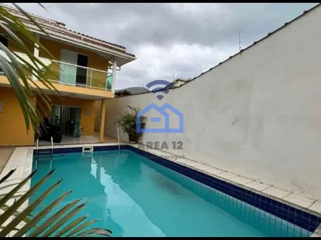 Casa com 300m² 4 quartos e 4 banheiros, à venda, no bairro Martim de Sá em Caraguatatuba
