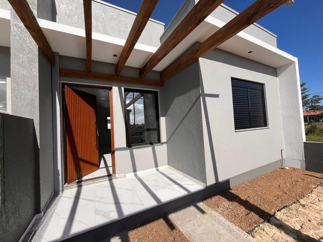 Foto do Casa - Casa geminada na praia, murada e cercada , à venda na  Zona Nova na cidade Tramandaí, RS | Executivo Imóveis