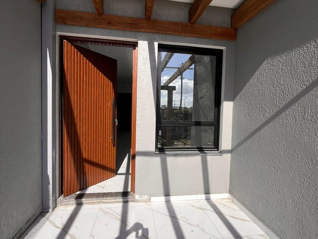 Foto do Casa - Casa geminada na praia, murada e cercada , à venda na  Zona Nova na cidade Tramandaí, RS | Executivo Imóveis