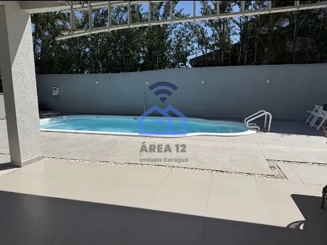 Casa com 420m² 4 quartos e 6 banheiros, à venda, no bairro Massaguaçu em Rua Hum