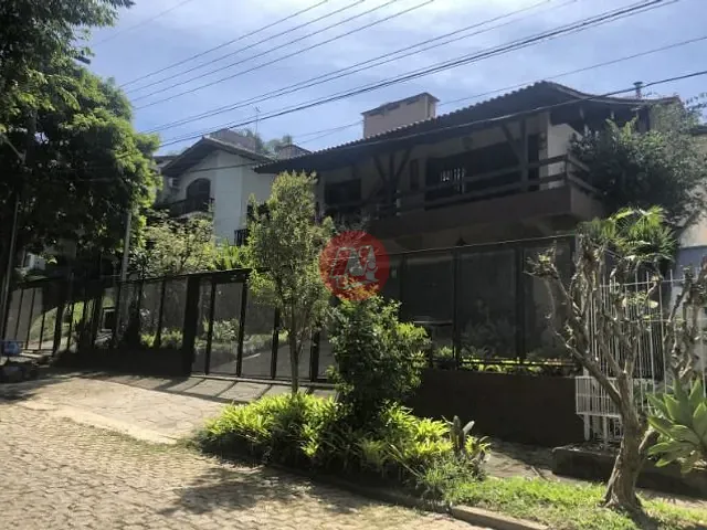 Casa com 920m² 5 quartos e 4 banheiros, à venda ou para alugar, no bairro Jardim Isabel em Porto Alegre