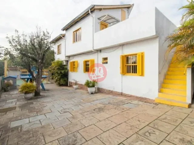 Casa com 800m², à venda ou para alugar, no bairro Vila Nova em Porto Alegre