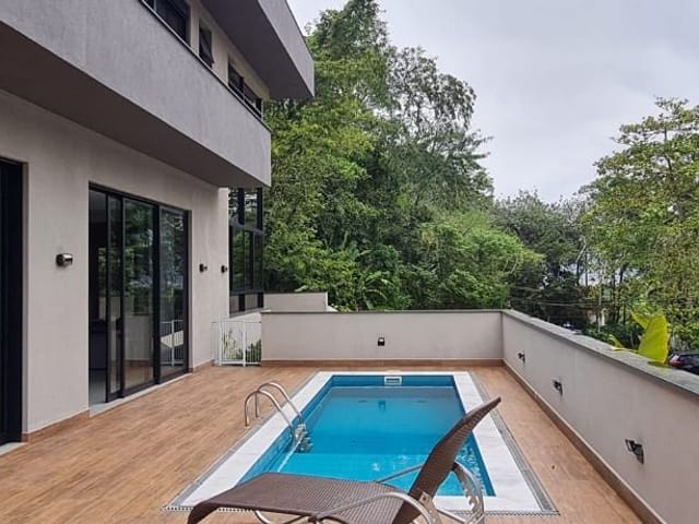 Foto do Casa - Casa com 4 dormitórios à venda, 230 m² por R$ 2.900.000,00 - Condomínio Recanto da Lagoinha - Ubatuba/SP | INDEPENDENCE NEGOCIOS IMOBILIARIOS LTDA