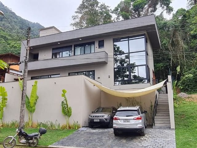 Foto do Casa - Casa com 4 dormitórios à venda, 230 m² por R$ 2.900.000,00 - Condomínio Recanto da Lagoinha - Ubatuba/SP | INDEPENDENCE NEGOCIOS IMOBILIARIOS LTDA