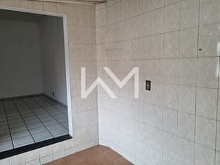 Foto do Casa-Casa de 2 Quartos com Sala Ampla, Cozinha Funcional, 1 Banheiro, 1 Vaga de Garagem e Lavanderia Integrada