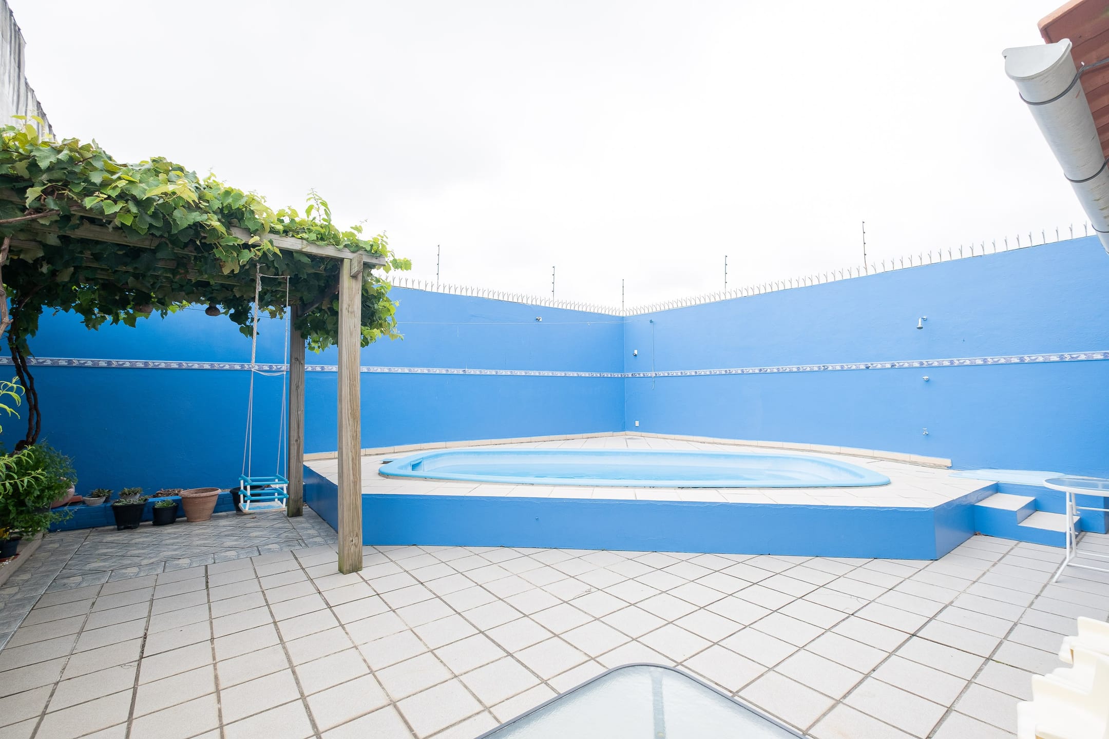 Casa à venda no Areal, Pelotas - com 310 m², 4 quartos (sendo 1 suíte), móveis planejados, lareira e amplo espaço gourmet com churrasqueira e piscina. - 33