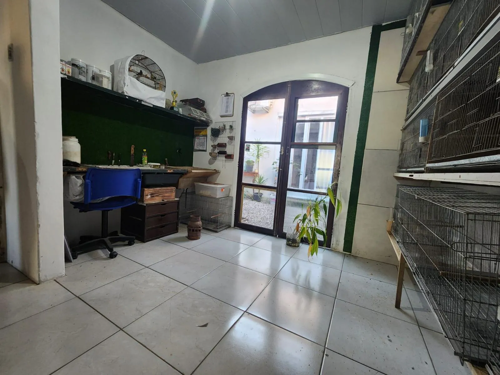 Casa à venda no Laranjal, Pelotas - 175 m², 2 quartos, lareira, amplo espaço gourmet com churrasqueira e pátio com piscina. - 13