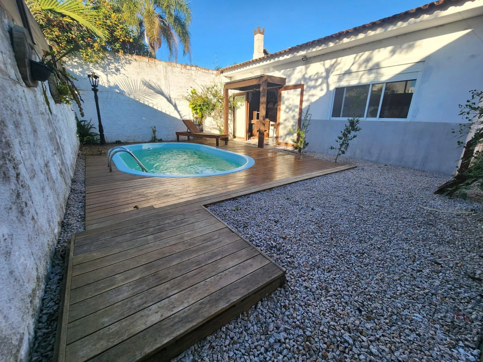 Casa à venda no Laranjal, Pelotas - 175 m², 2 quartos, lareira, amplo espaço gourmet com churrasqueira e pátio com piscina. - 19