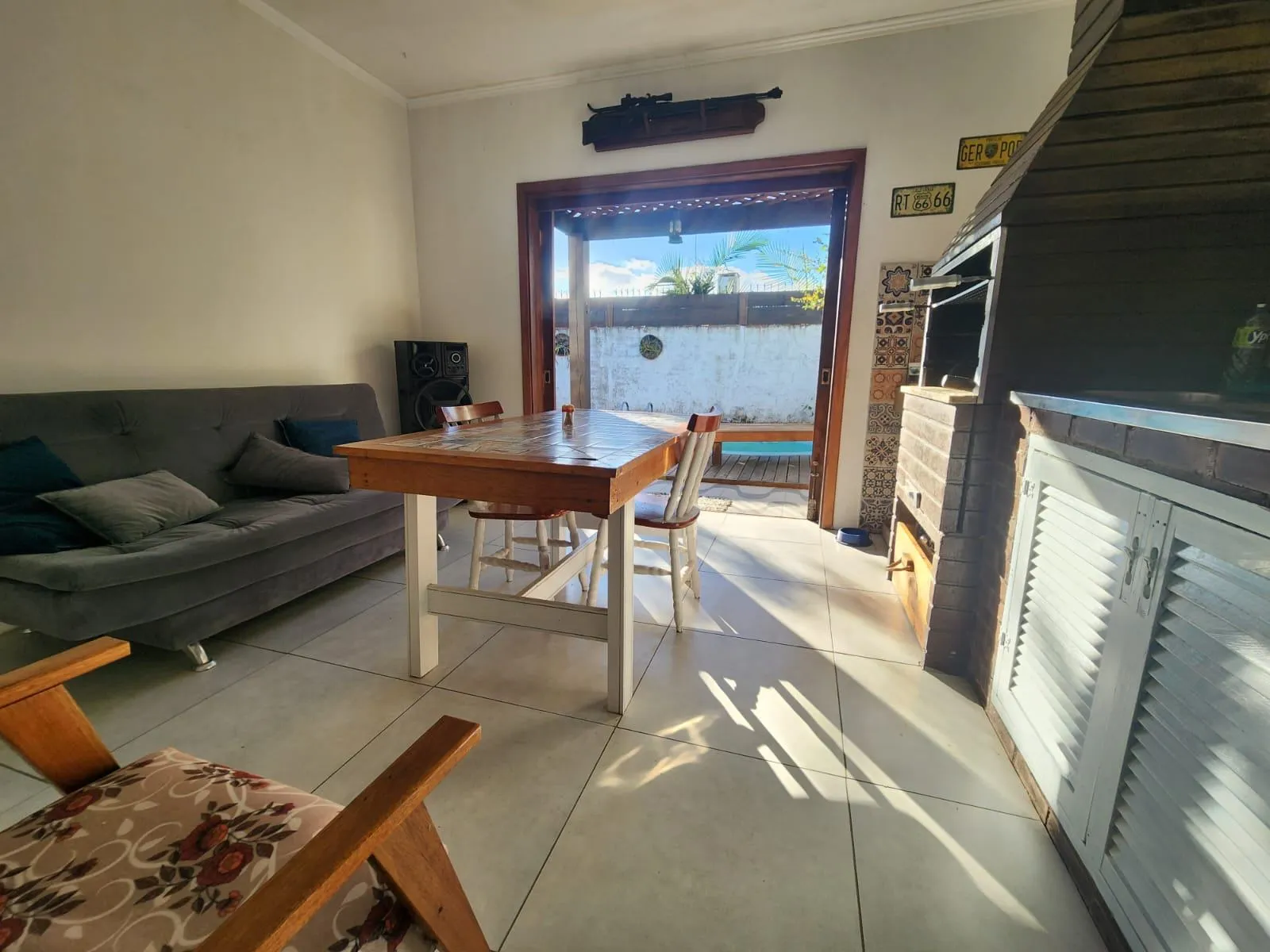 Casa à venda no Laranjal, Pelotas - 175 m², 2 quartos, lareira, amplo espaço gourmet com churrasqueira e pátio com piscina. - 14