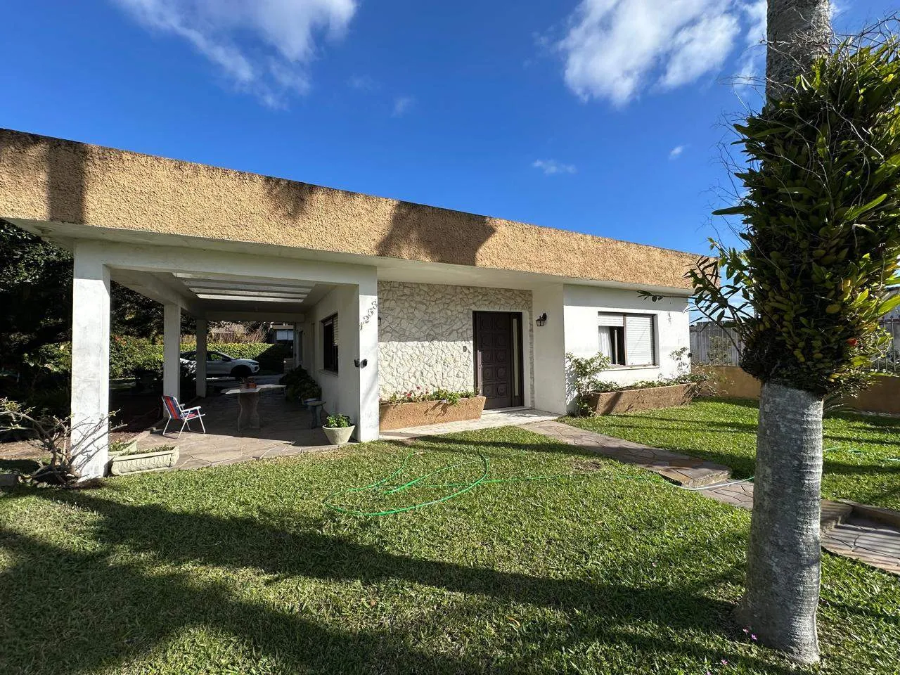 Casa à venda no Fragata, Pelotas - 145 m², 2 quartos (sendo 1 suíte), sala com lareira, cozinha planejada, churrasqueira e amplo pátio. - 11