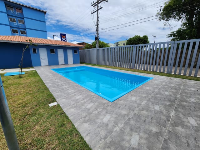 Condomínio do Apartamento - Apartamento mobiliado com sacada e churrasqueira, vaga de garagem privativa e localização estratégica para estudantes no Condomínio Praça XX. | UP Imóveis