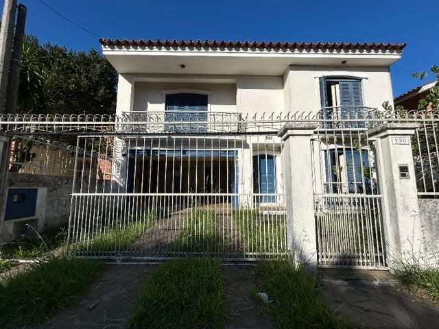 Foto do Sobrado - Sobrado 257 m² – 4 Dormitórios (3 Suítes), 3 Salas, Lareira Dupla, Hidromassagem, 2 Vagas | Areal, Pelotas/RS | Pátio Amplo & Churrasqueira | UP Imóveis