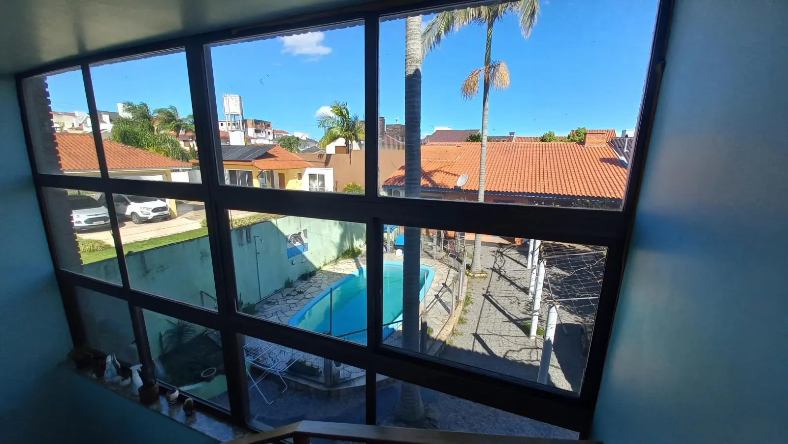 Casa à venda na Colina do Sol, Pelotas - 273 m², 5 quartos (sendo 1 suíte), lareira, espaço gourmet com churrasqueira, pátio e piscina. - 8
